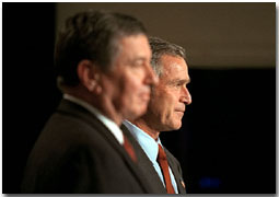 Introduced by Attorney General John Ashcroft, President George W. Bush addresses a group of new U. S. Attorneys at the Dwight D. Eisenhower Executive Office Building Nov. 29. "I want to congratulate you. I must tell you that we set a high standard, and you met it. And for that, I hope you're proud," said the President in his remarks. "And I am grateful that you are willing to serve the country, particularly at this time." White House photo by Paul Morse.